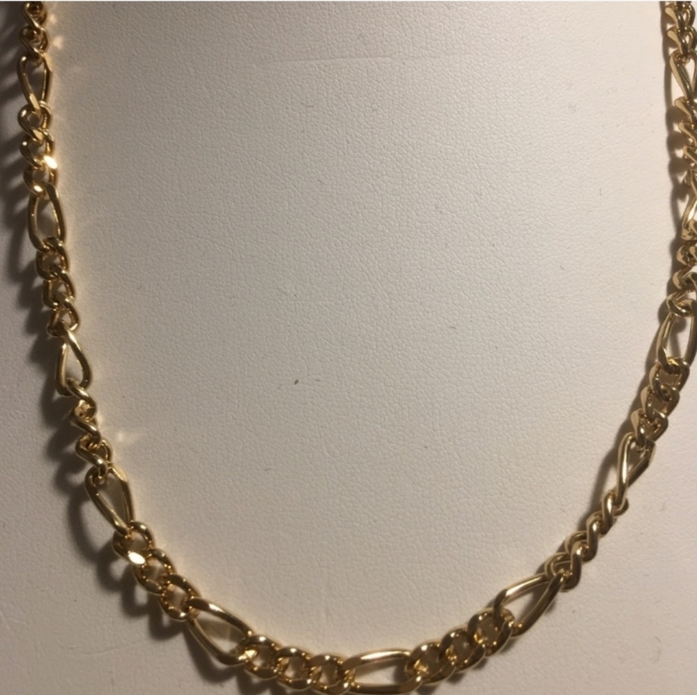 A gold Figaro necklace